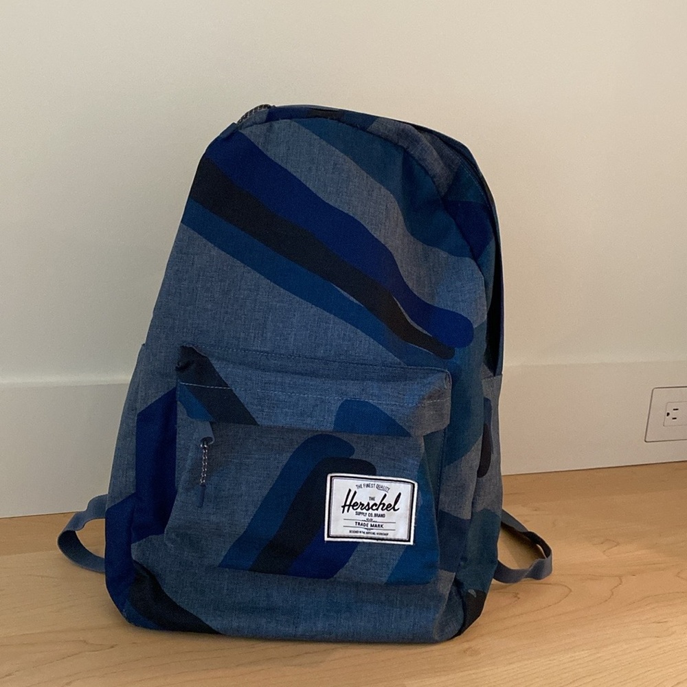 Herschel Supply Co. brand large backpack. Shades of blue.